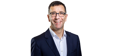 Dave DiPersio stand in front of a white background