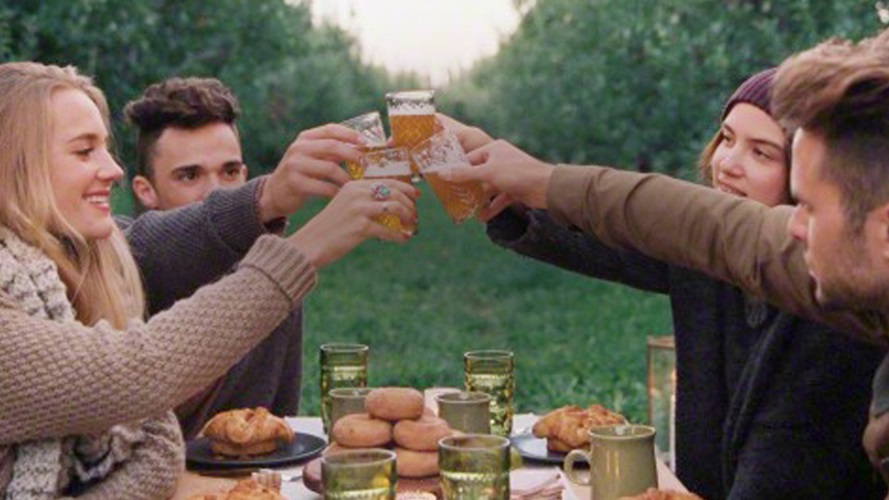 Raising glasses of cider with friends