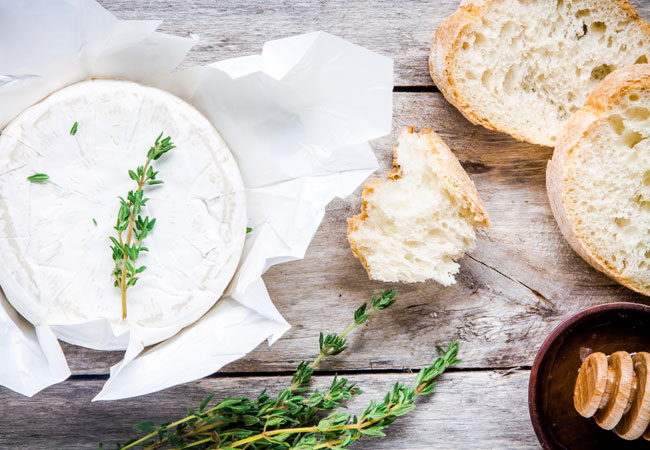 freshly cut bread with a garnished spread