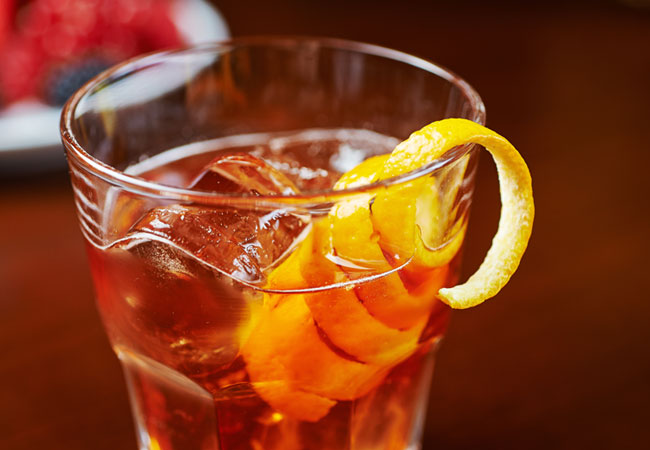Old Fashioned cocktail with orange rind garnish