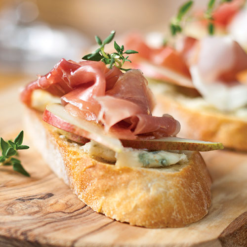 A crostini topped with prosciutto