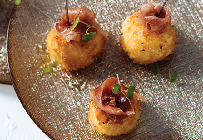 3 fried goat cheese balls topped with prosciutto