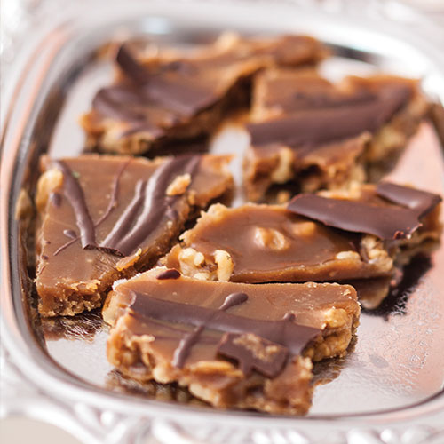 Chocolate walnut pieces on a silver platter