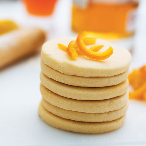 Shortbread cookies topped with an orange peel