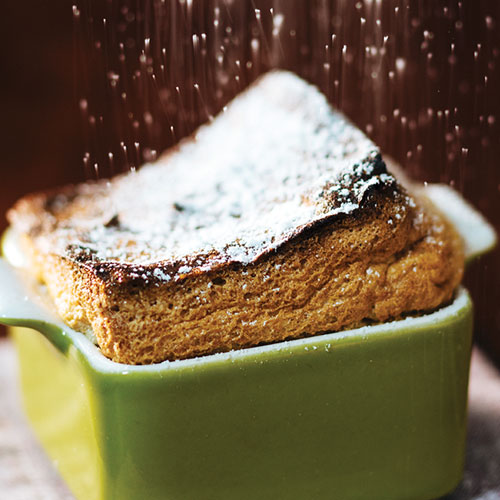 A pumpkin soufflé topped with icing sugar
