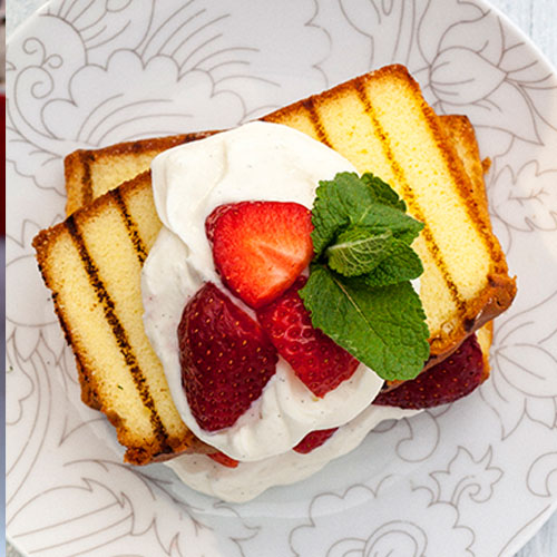 Grilled pound cake topped with ricotta and strawberries