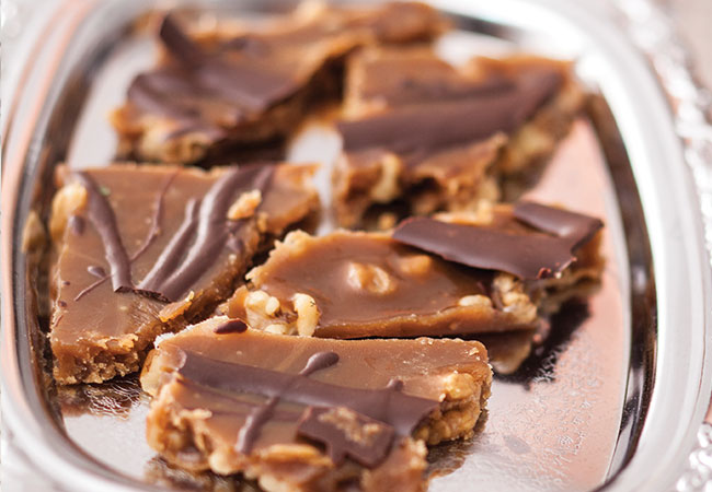 Chocolate walnut pieces on a silver platter