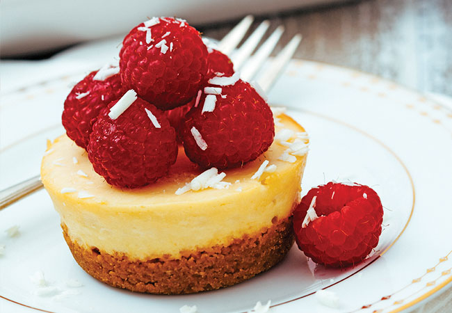 Mini cheesecake topped with raspberries