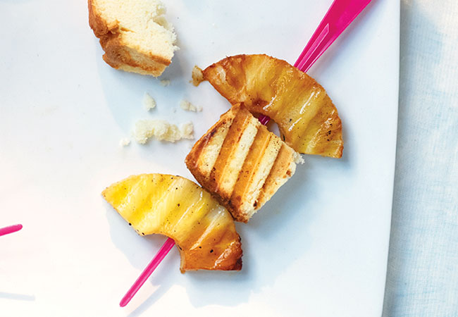 Grilled pineapple and pound cake on a skewer