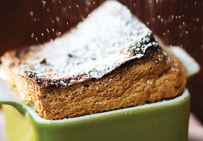 A pumpkin soufflé topped with icing sugar