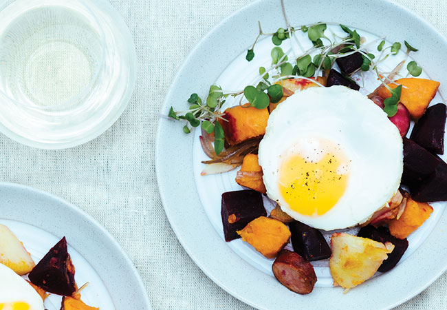 Mixed cooked vegetables topped with an egg