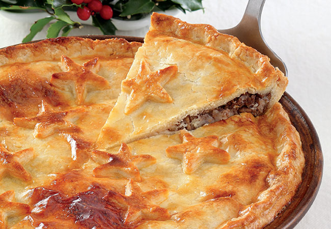 A golden pie with star cut outs on top