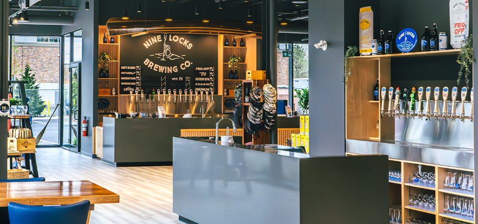 Image of the new Nine Locks tap room with two beautiful bars with lots of beer taps