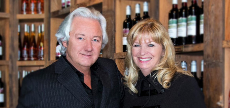 Jost Vineyard's two owners standing in their wine shop.