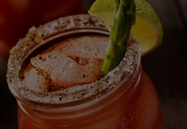 Caesar with asparagus and lime garnish.