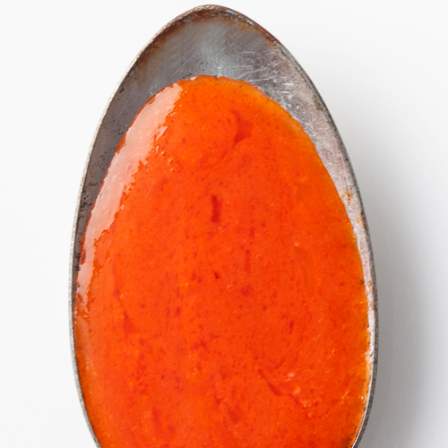 Classic Buffalo Wing Sauce on a spoon