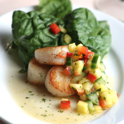 Pan Seared Scallops with Chipotle Lime Cream, mango salsa and spinach