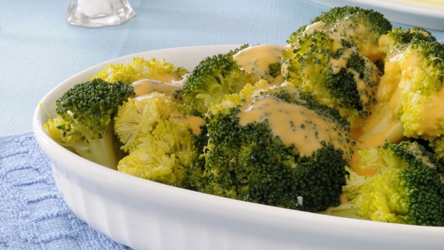 Bed of broccoli smothered in a creamy cheese sauce