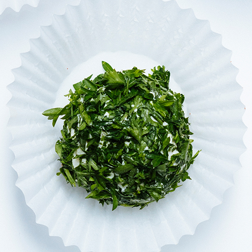 Mixed Herb and Parmesan Cheese Ball on a fanned plate